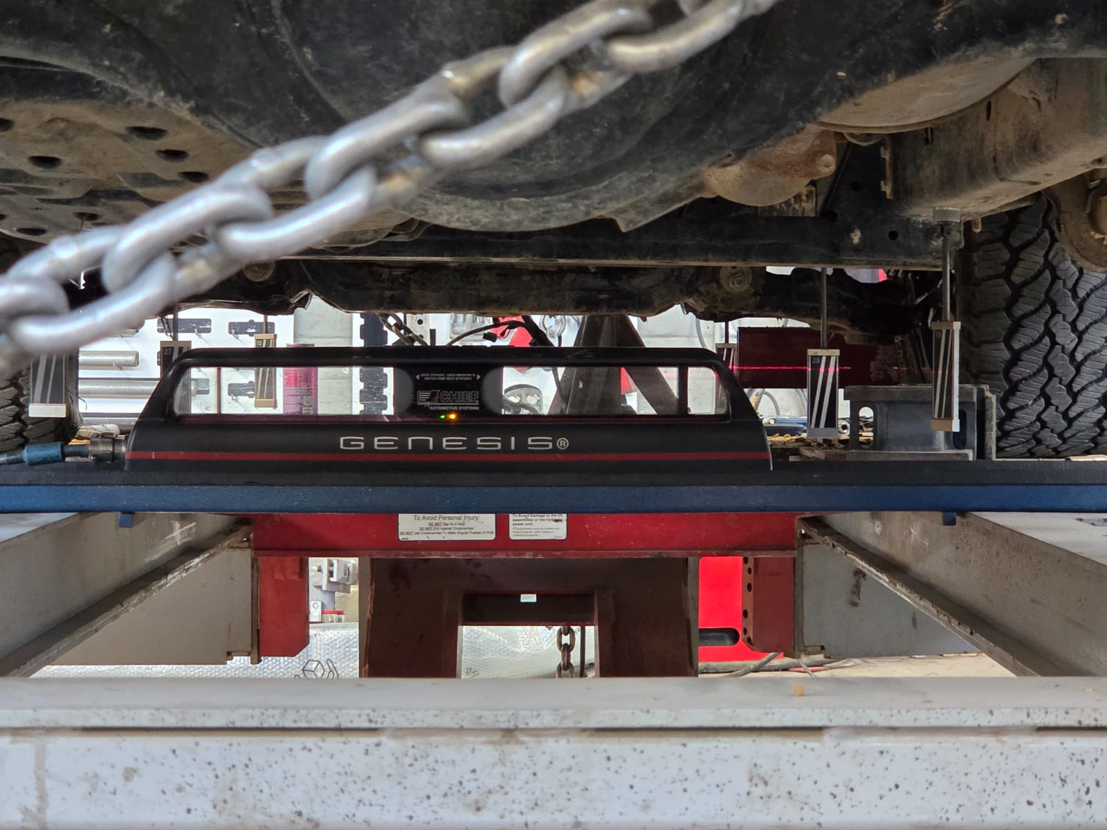 Underside view of vehicle on Chief Genesis measurement benchrack system